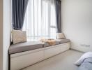 cozy window seating area in a bedroom with cushions and natural light