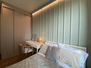 Modern bedroom with built-in wardrobes and desk