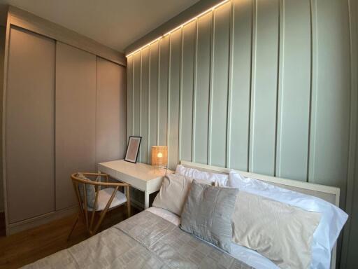 Modern bedroom with built-in wardrobes and desk