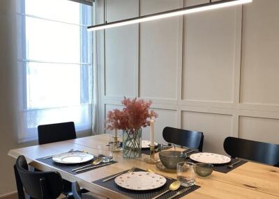 Modern dining area with a set table