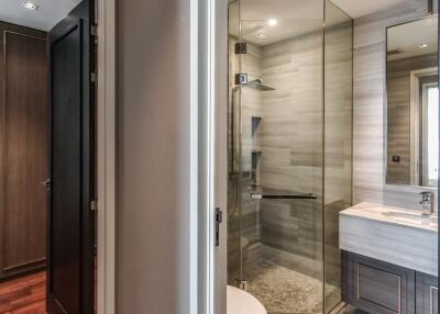 Modern bathroom with glass shower door and vanity