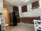 Modern kitchen with wooden cabinets and dining area