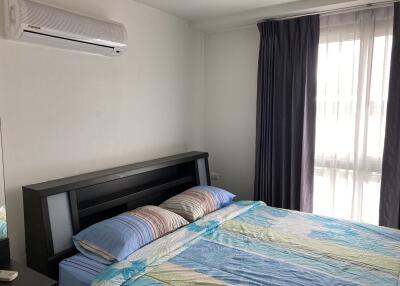 Modern bedroom with air conditioner and large window