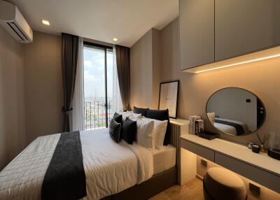 Modern bedroom with large window and vanity