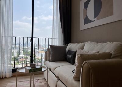 Modern living room with sofa and city view