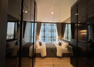 Modern bedroom with mirrored wardrobes