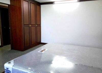 Modern bedroom with large wardrobe and new bed