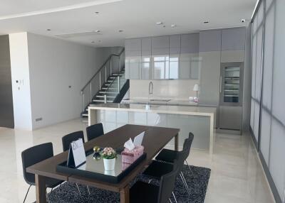 Modern kitchen and dining area with stairs