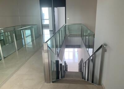 Modern interior staircase with glass railings