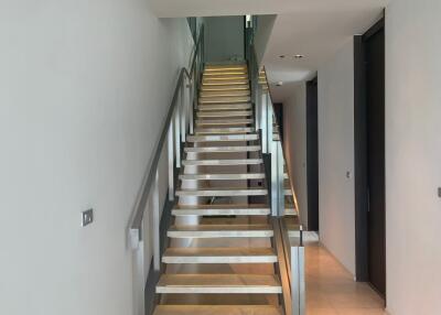 modern stairway with glass and metal railings