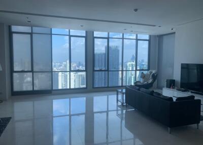 Modern living room with large windows and city view