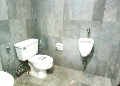 Bathroom with toilet and urinal