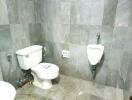 Bathroom with toilet and urinal