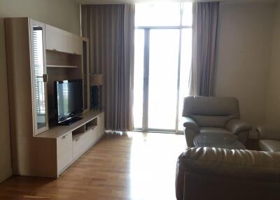 Living room with wooden flooring, entertainment center, and leather seating