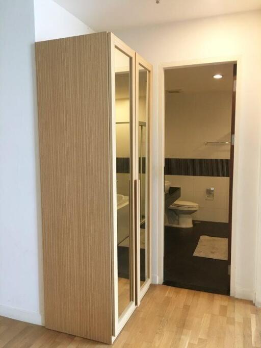 Bathroom with a wooden wardrobe