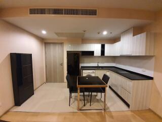 Compact modern kitchen with dining area