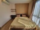 Bedroom with double bed, desk, and air conditioning