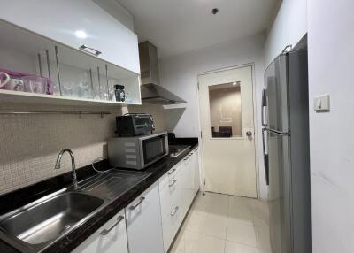 Modern kitchen with appliances and tile backsplash