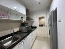 Modern kitchen with appliances and tile backsplash