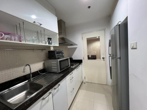 Modern kitchen with appliances and tile backsplash