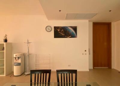 Dining area view with clock and wall decor