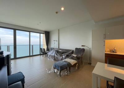 Modern living room with ocean view and natural lighting