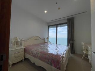 spacious bedroom with sea view