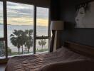 Bedroom with large window and ocean view