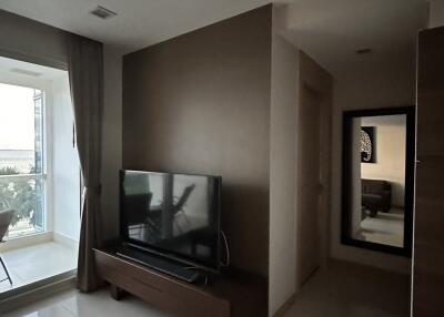 Living room with TV and window