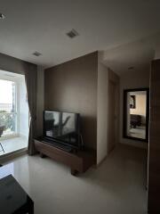 Living room with TV and window