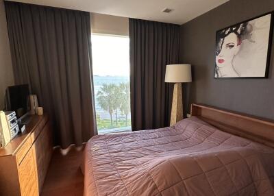 Bedroom with a large window and modern decor