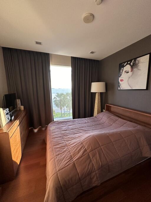 Bedroom with a large window and modern decor