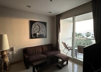 Well-lit living room with a sofa and wall art