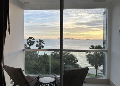 Balcony with a view of the ocean at sunset