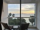 Balcony with a view of the ocean at sunset