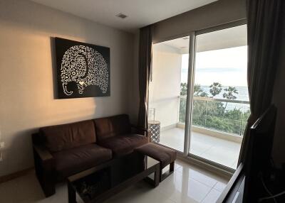 Contemporary living room with modern decor and large windows