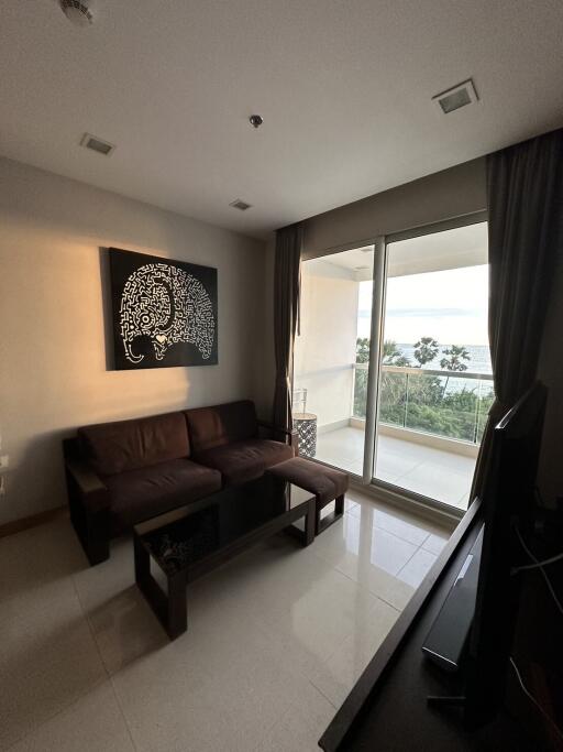 Contemporary living room with modern decor and large windows