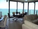 Modern living room with sea view and dining area