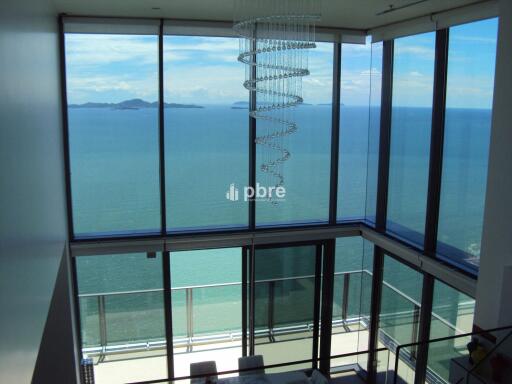 Spacious living area with large windows and ocean view