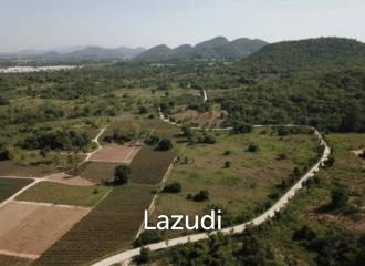 Beautiful elevated land of 15 Rai with great views near Banyan Golf Club.