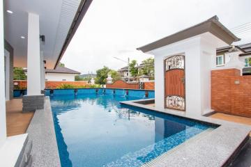 3 Bed single-storey house with L-shaped swimming pool at Grand Tropicana by Sansaran