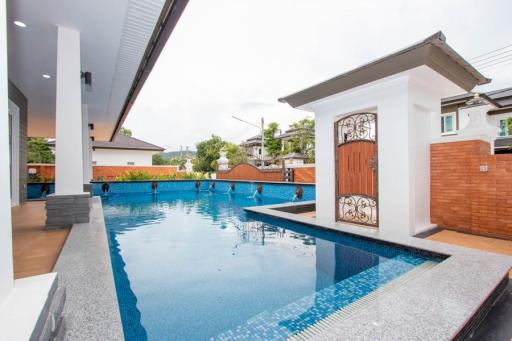 3 Bed single-storey house with L-shaped swimming pool at Grand Tropicana by Sansaran